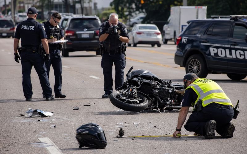 Motorcycle accident investigation scene showing the importance of rider safety equipment